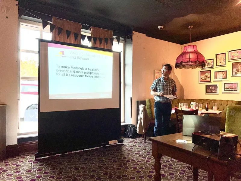 A speaker presenting at a Mansfield Rotary club meeting